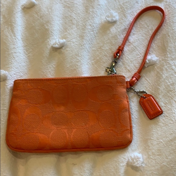 Coach Handbags - HP 🎉 Orange Coach Wristlet